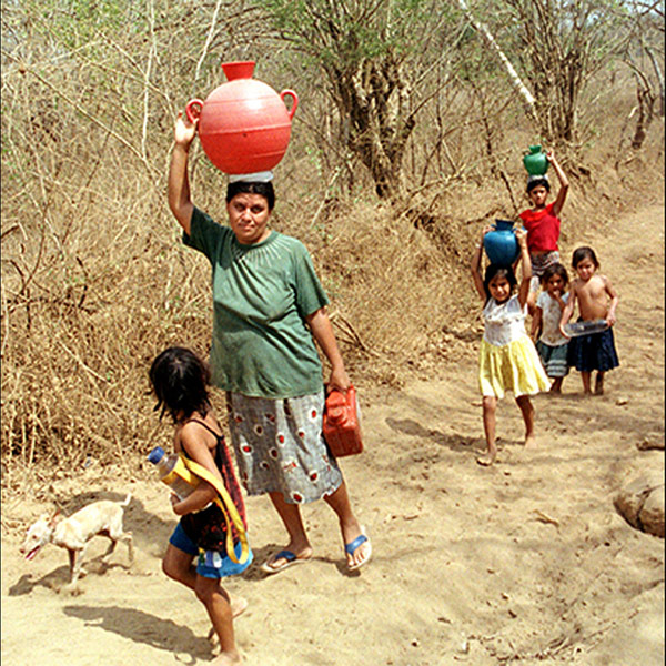 Women Carrying Water in the 4th of July Community